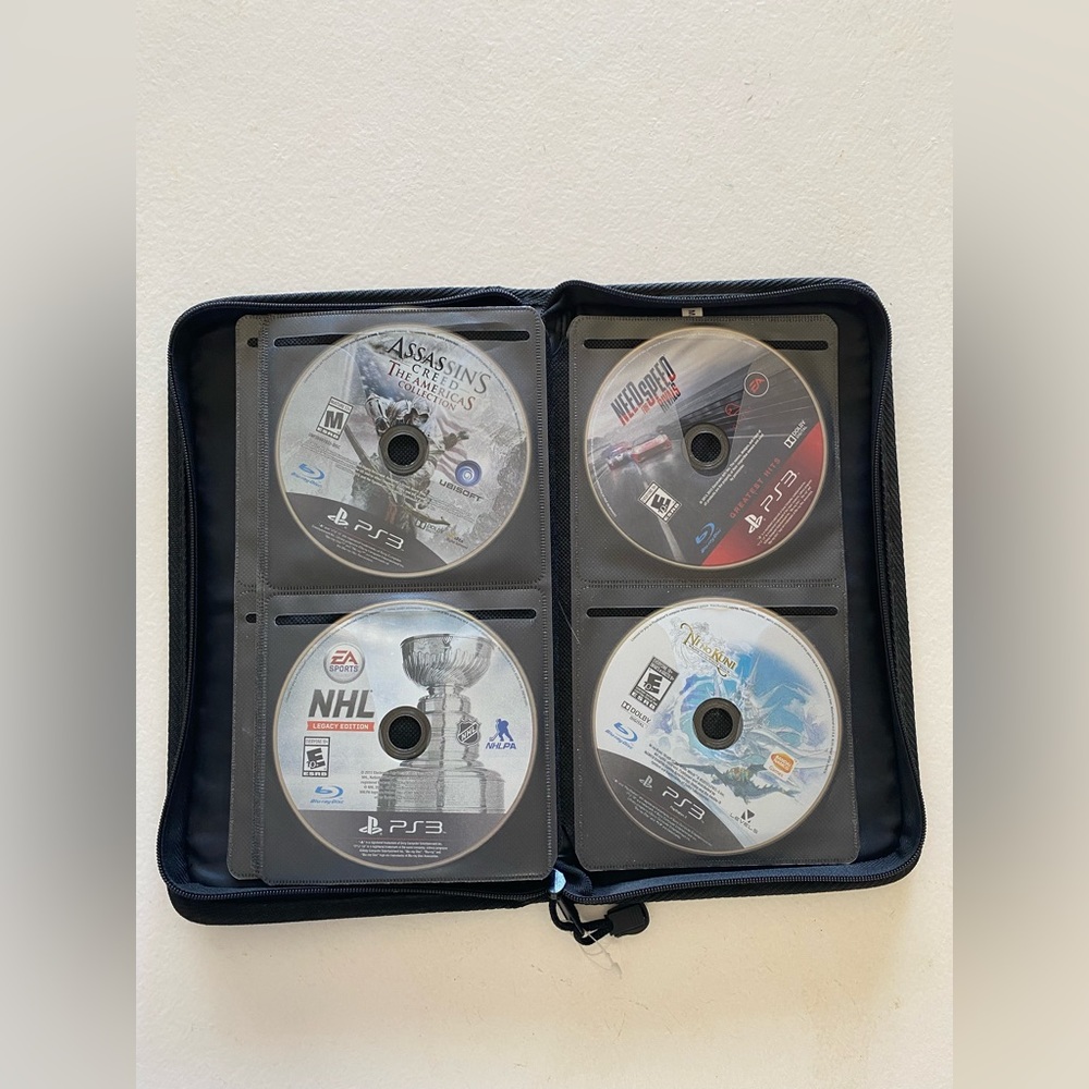 Assorted PS3 Games and Faux Leather Case